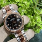 Black-dial stainless steel sports watch